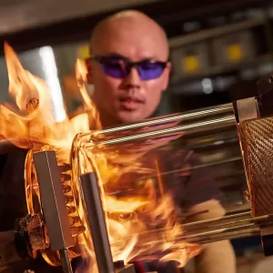 A gaffer making a glass reactor at GlasKeller